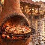 Poêle mexicain : brasero en terre cuite sur pavés, pizza dorée